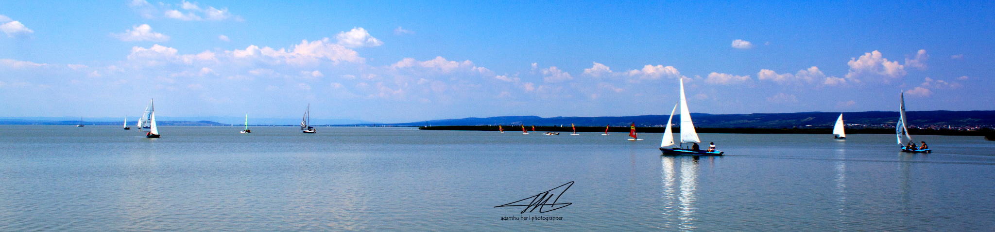 Panoramic lake and sailboats