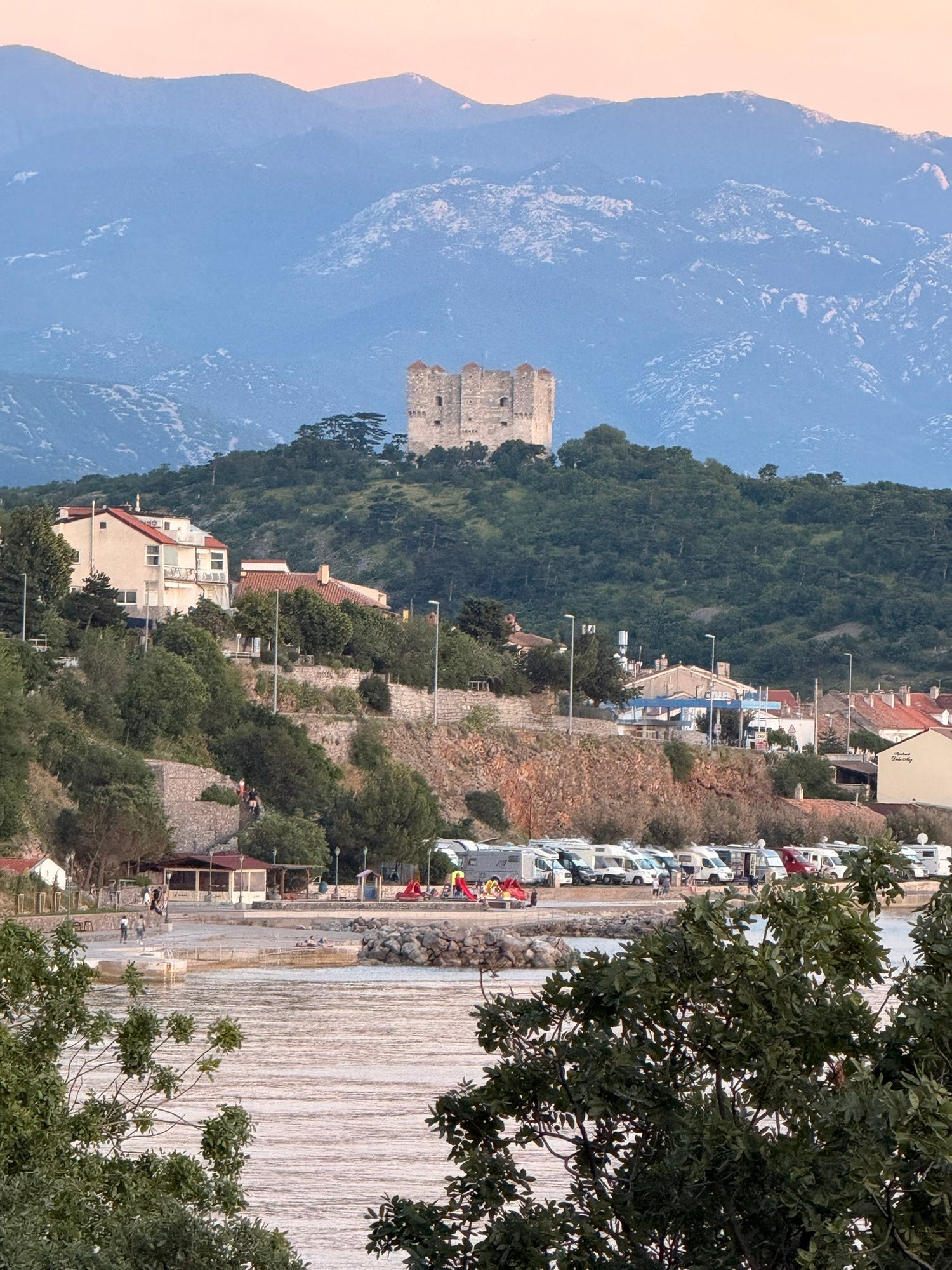 Coastal castle and mountains